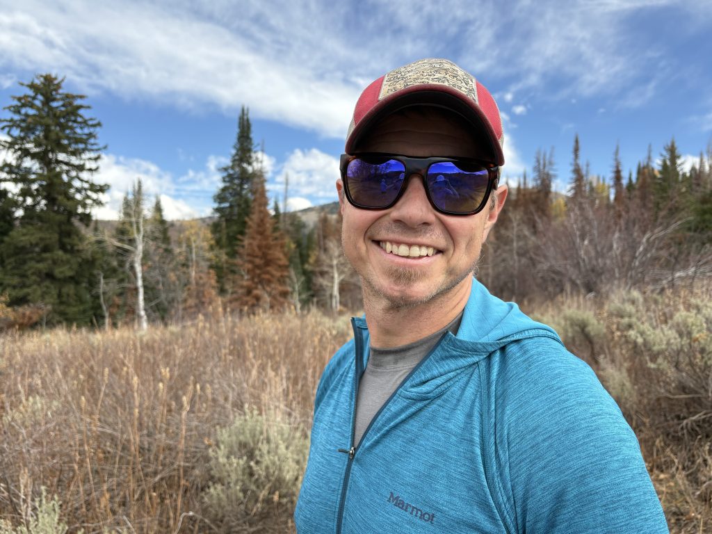 Headshot of Bennett Colvin with trees in background.