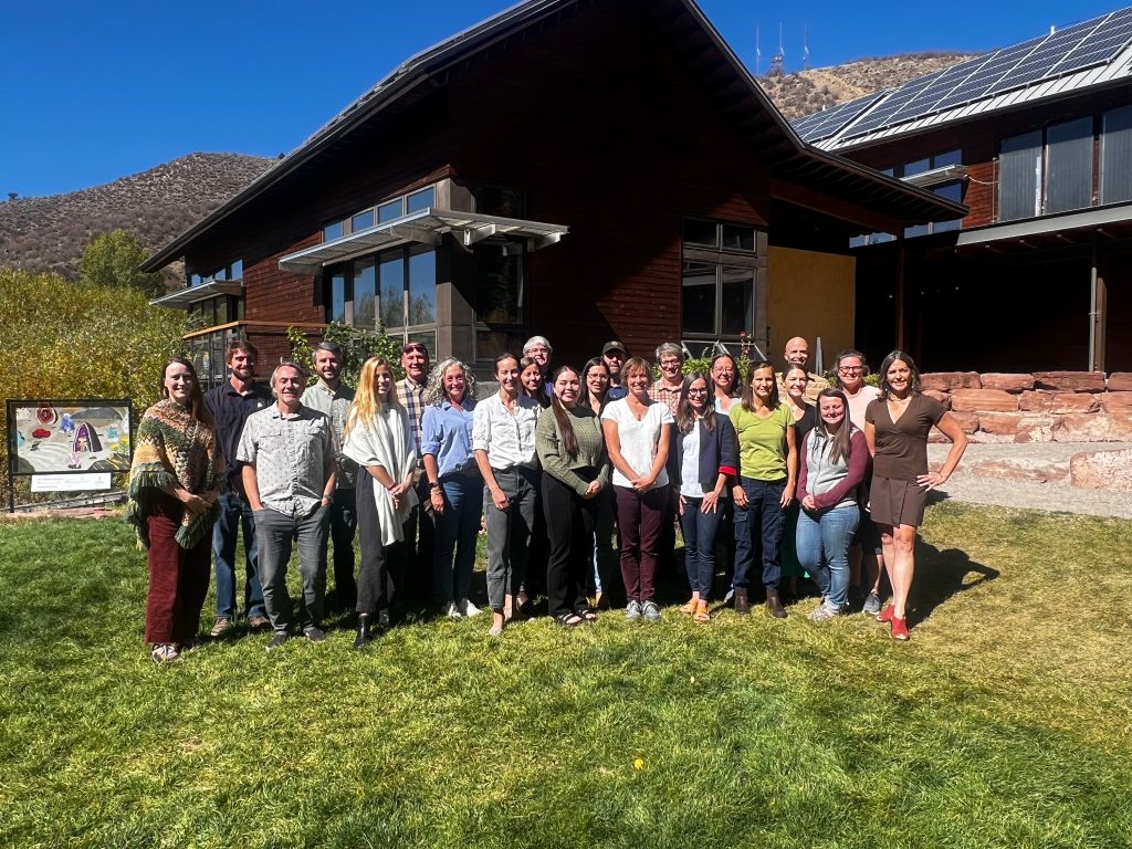 Image of Energy Smart Colorado team and partners together outside posting in group photo.