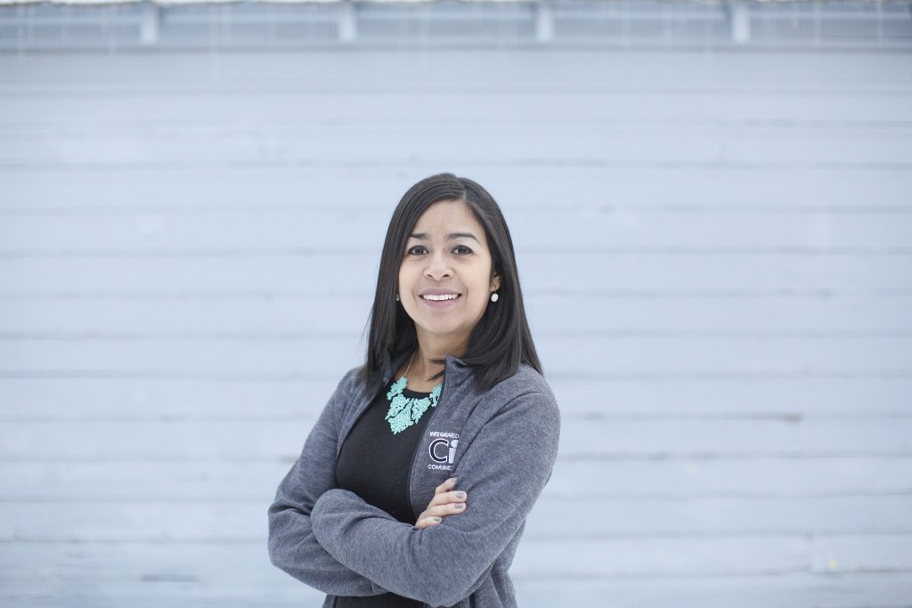 Photo of Nelly Navarro posing with white background.