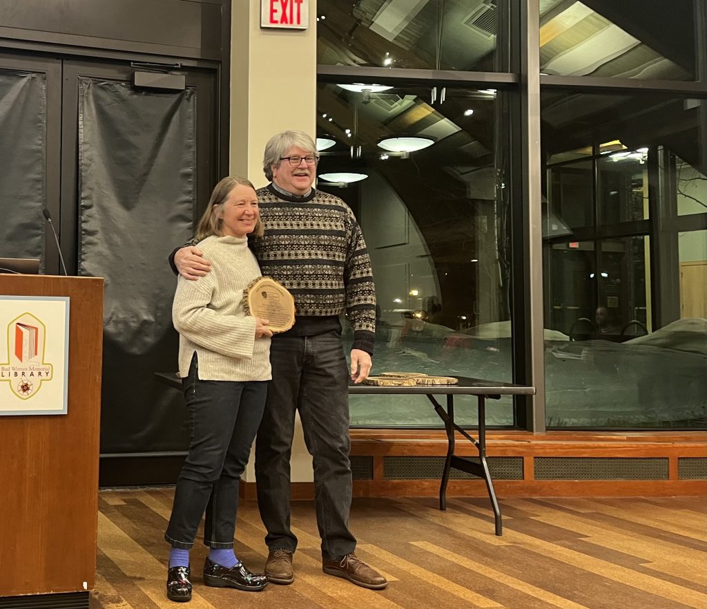 Winnie DelliQuadri and Paul Bony pose with her sustainability award at Library Hall.