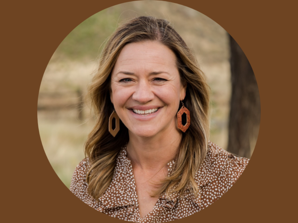 Headshot of Jayla Poppleton smiling with brown background